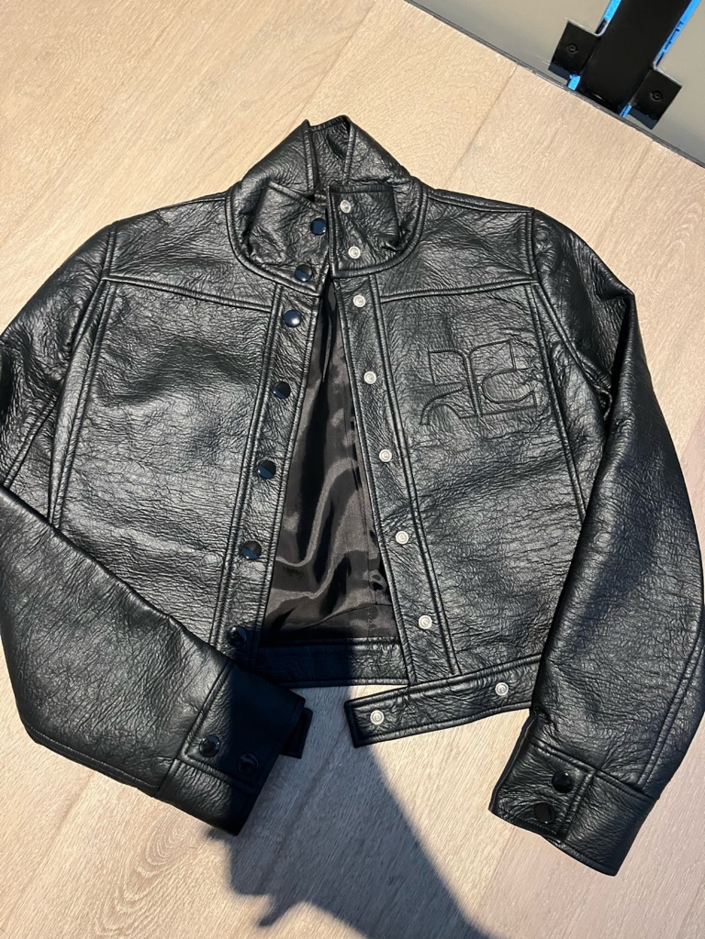 Courreges Black Cropped Leather Jacket with Embossed Logo